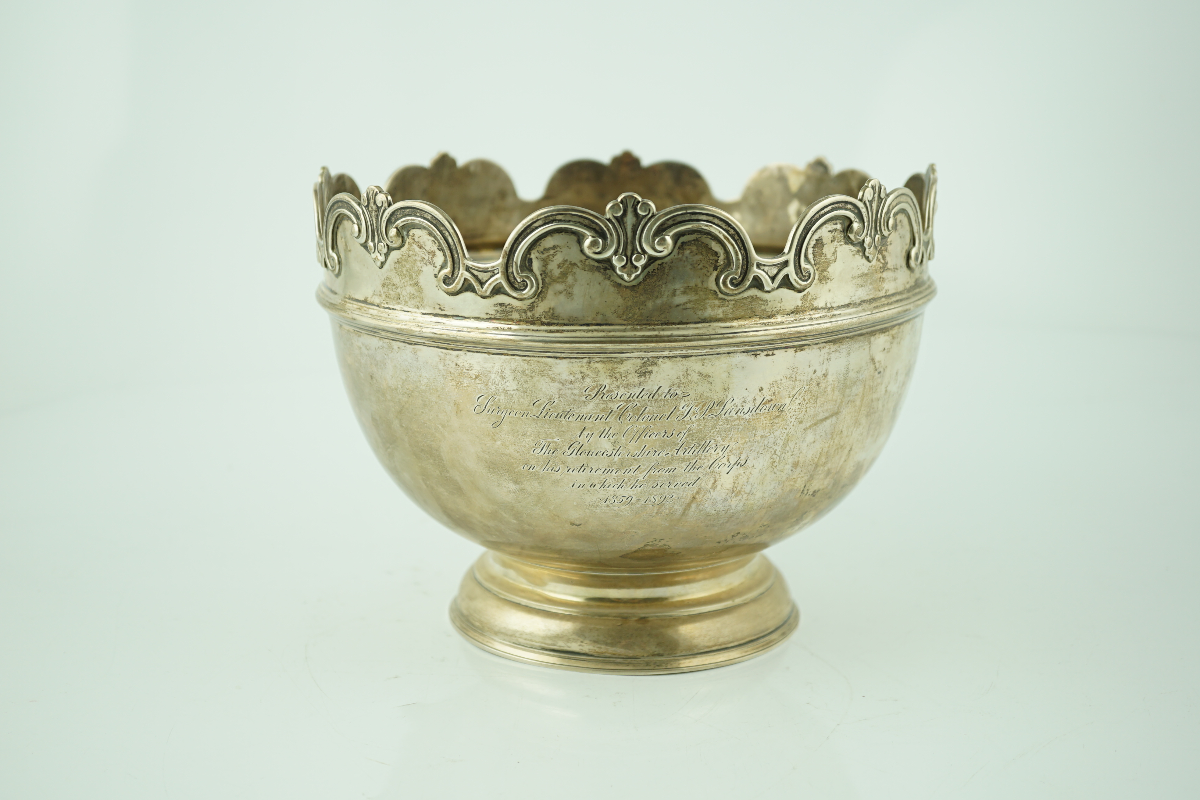 A late Victorian silver presentation Monteith by William & John Barnard, with engraved armorial and inscription related to Surgeon Lieutenant Colonel F.P. Lansdown